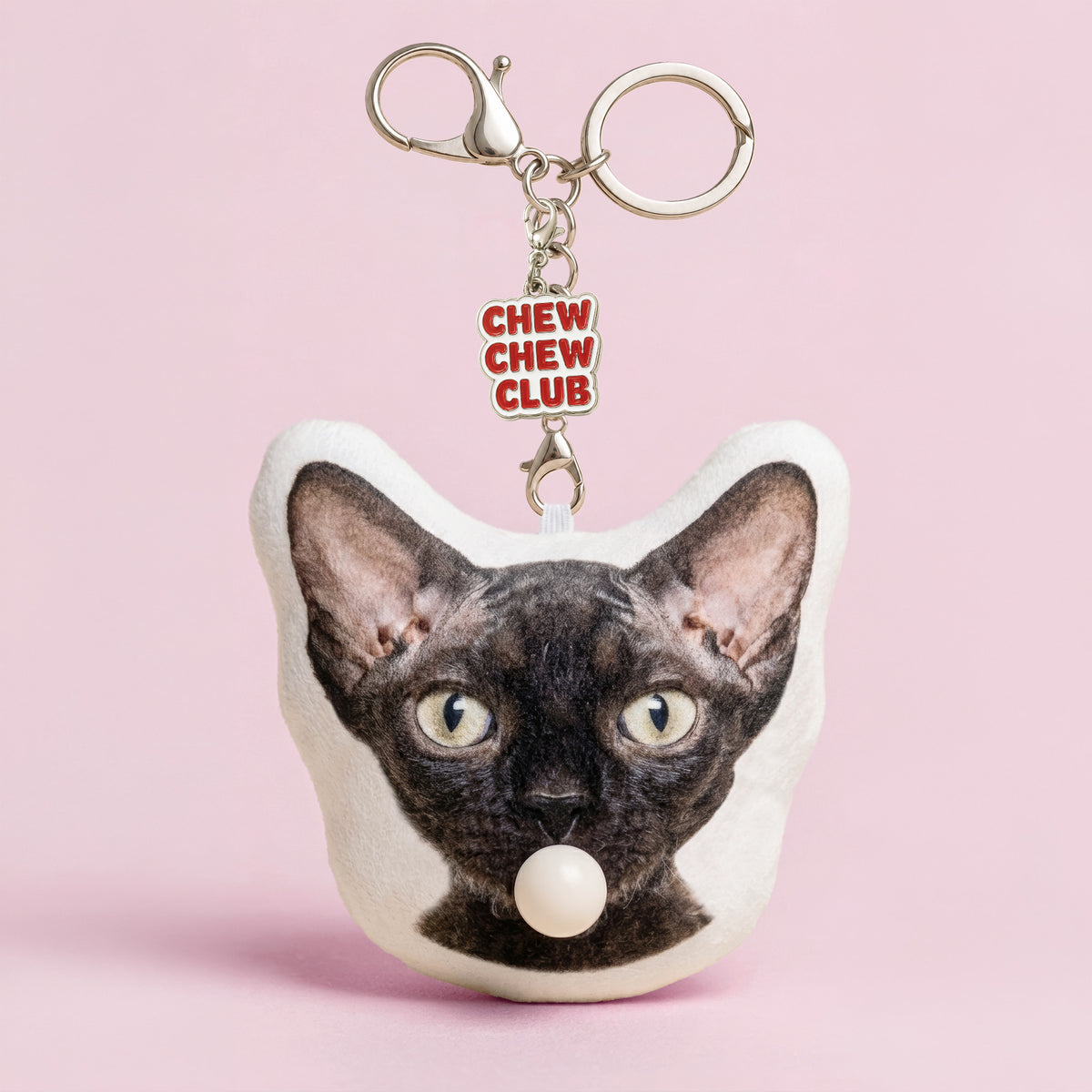 Custom Devon Rex cat head plush keychain made from a pet photo with bubble-blowing feature and enamel charm