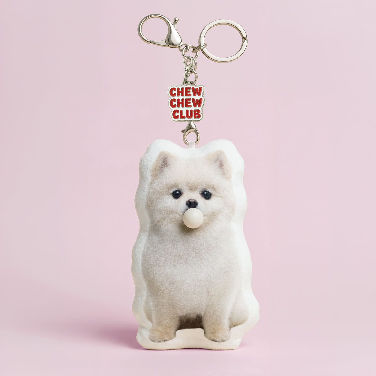 Front of custom Pomeranian dog plush keychain from a pet photo with bubble-blowing feature and Chew Chew Club charm