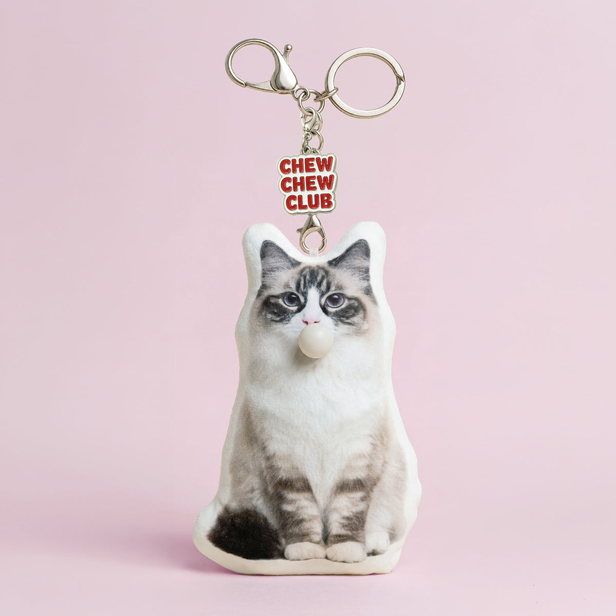 Custom Ragdoll cat plush keychain made from a pet photo with bubble-blowing feature and Chew Chew Club enamel charm