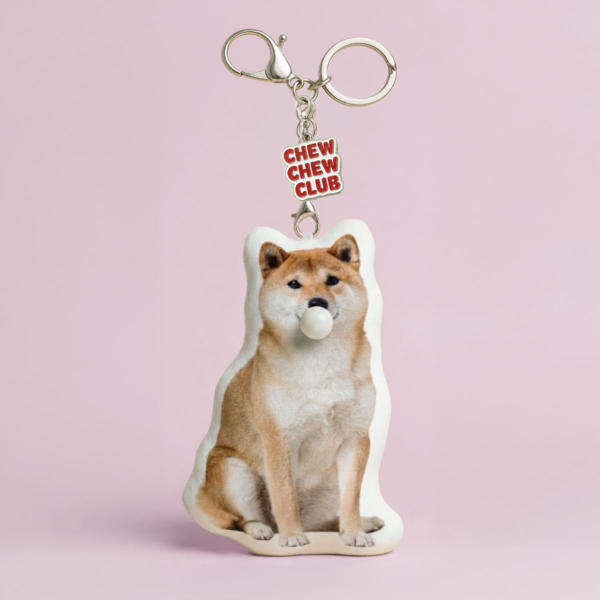 Custom Shiba Inu dog plush keychain made from a pet photo with bubble-blowing feature and Chew Chew Club enamel charm