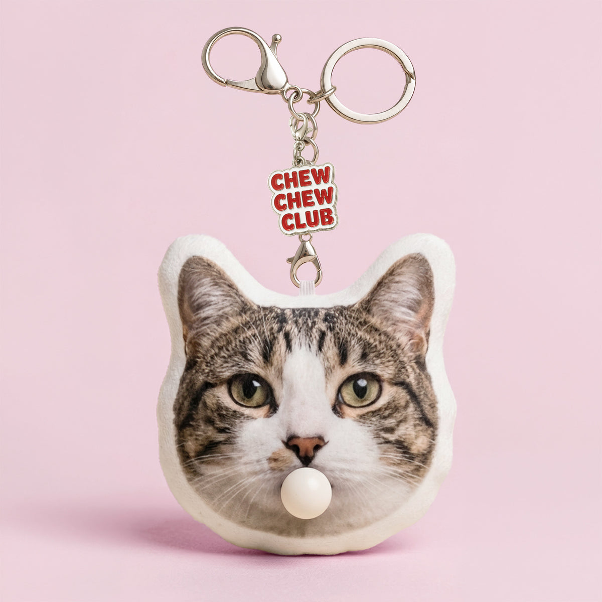 Custom tabby cat head plush keychain from a pet photo with bubble-blowing feature and enamel charm